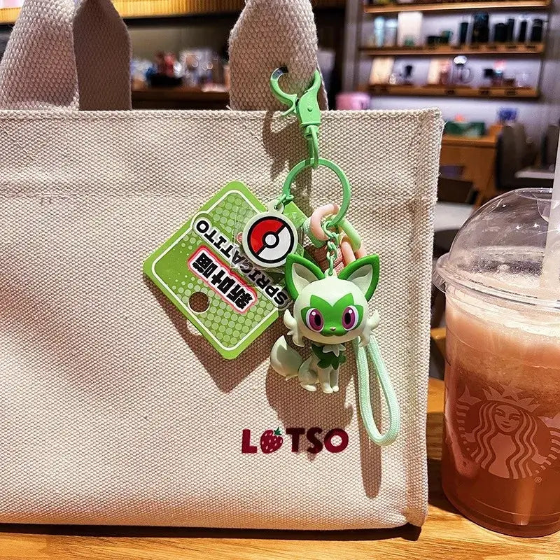 A Genuine Pokemon Keychain featuring a 3D Pikachu and Gengar anime action figure with a fragrance pendant design for backpacks.