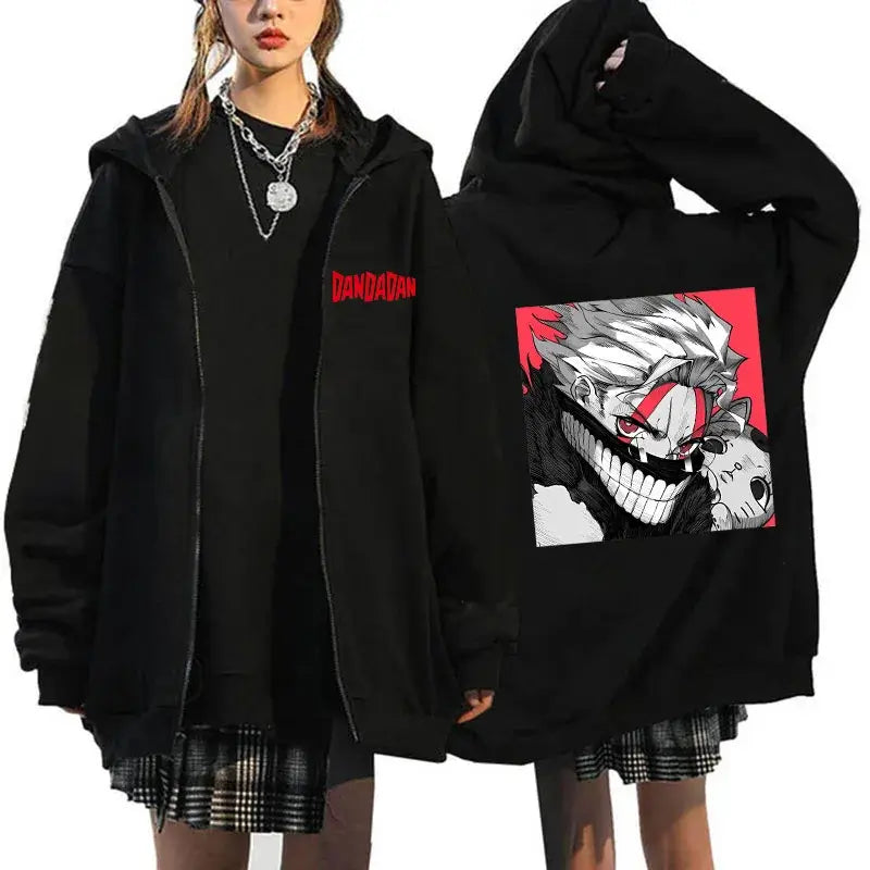 A youthful female model wearing the funny designer Dandadan Okarun Zip Up Hoodie with an anime and manga print.