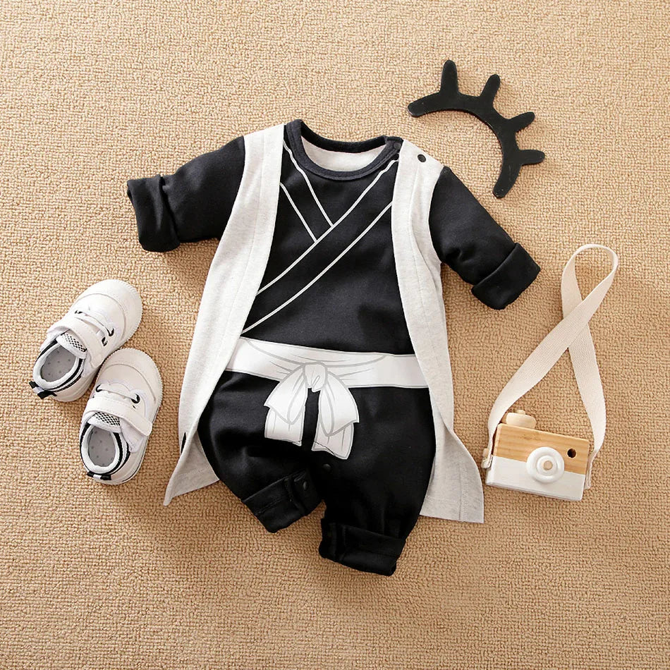 A newborn infant wearing the Baby Anime Costume, a cosplay jumpsuit available in Luffy, Akatsuki, and Vegeta styles.