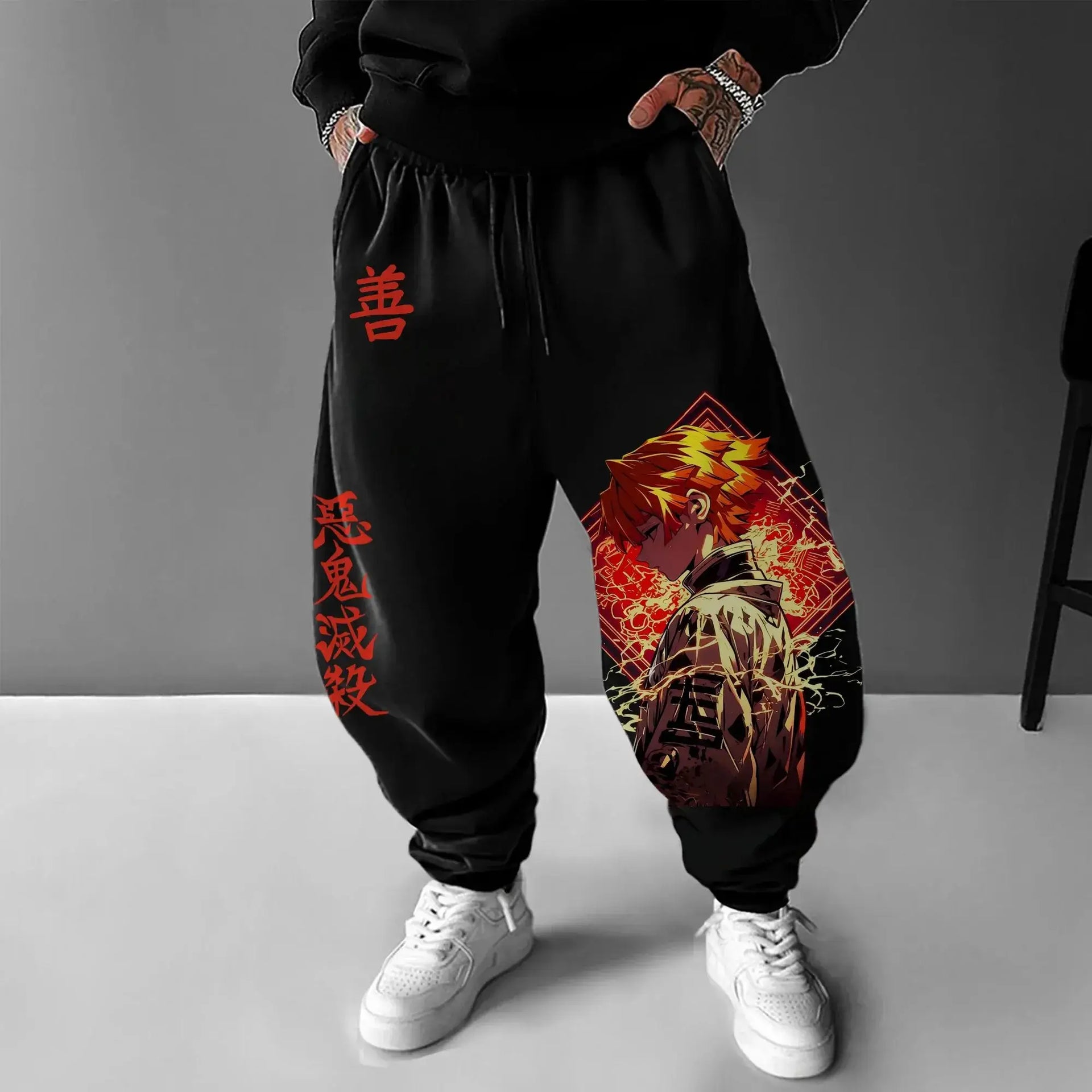 A man wearing the loose-fit Demon Slayer Anime Men Sweatpants with a Japanese cartoon print, showcasing a casual hip hop and Y2K streetwear style.