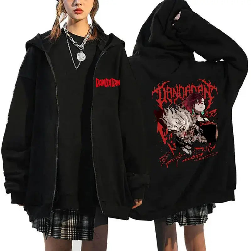 A youthful female model wearing the funny designer Dandadan Okarun Zip Up Hoodie with an anime and manga print.