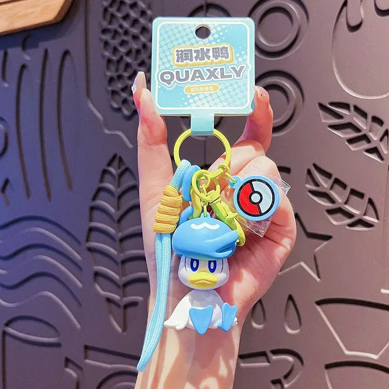 A Genuine Pokemon Keychain featuring a 3D Pikachu and Gengar anime action figure with a fragrance pendant design for backpacks.