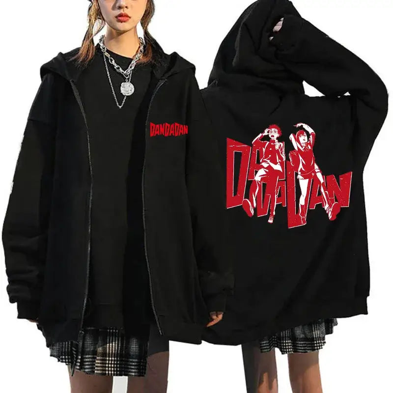 A youthful female model wearing the funny designer Dandadan Okarun Zip Up Hoodie with an anime and manga print.