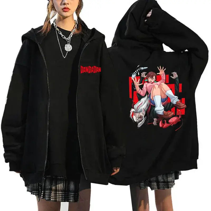 A youthful female model wearing the funny designer Dandadan Okarun Zip Up Hoodie with an anime and manga print.