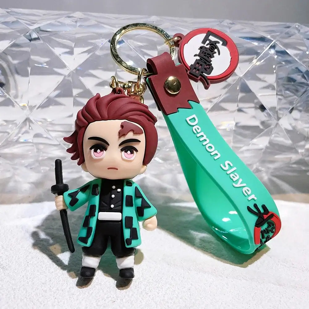 3D Demon Slayer Keychains featuring cute anime character dolls like Tanjiro and Nezuko, used as car ignition accessories and backpack pendants.