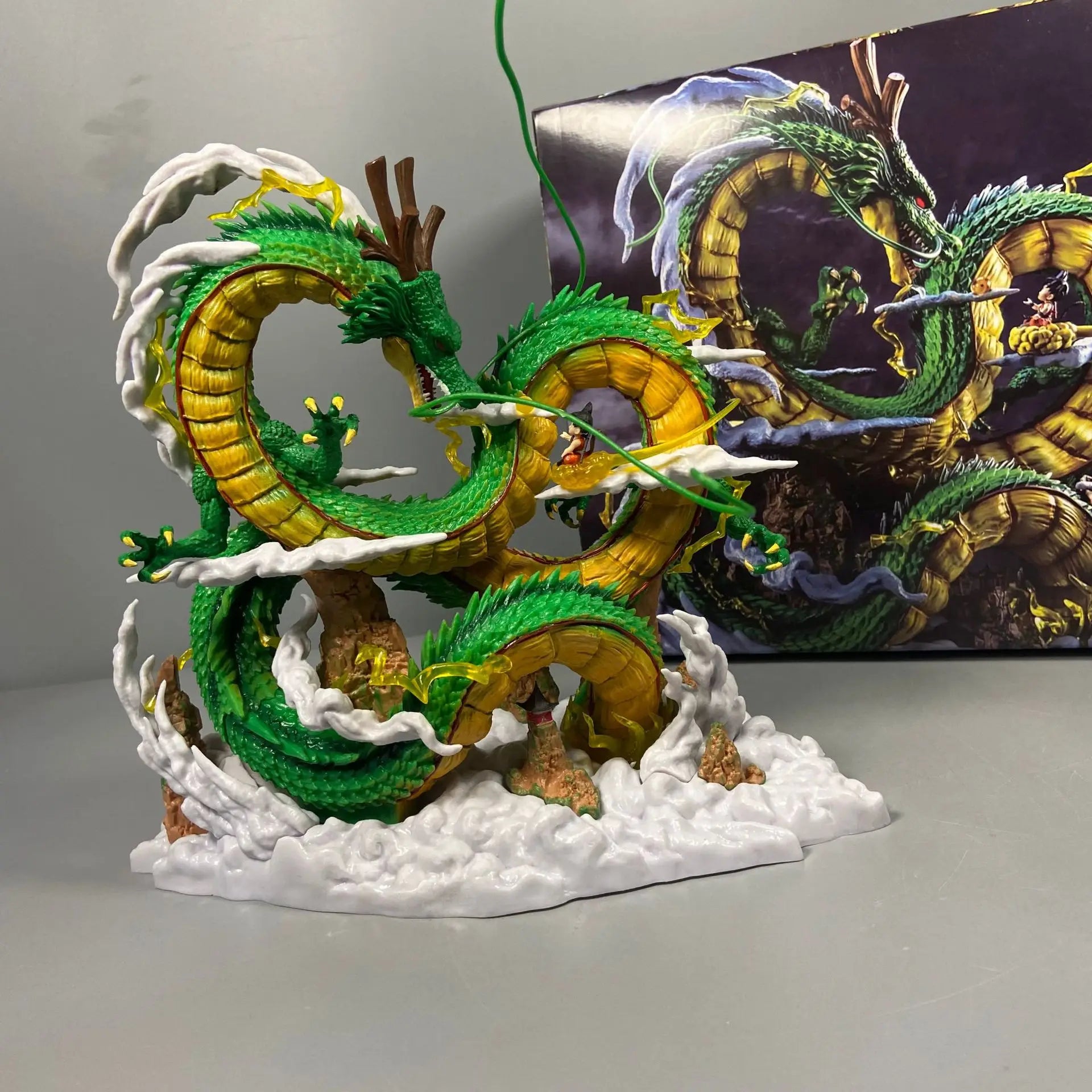 A 24cm Dragon Ball Shenron Figure made of high-quality PVC, featuring Son Goku standing with the Eternal Dragon, ideal for anime room decoration.