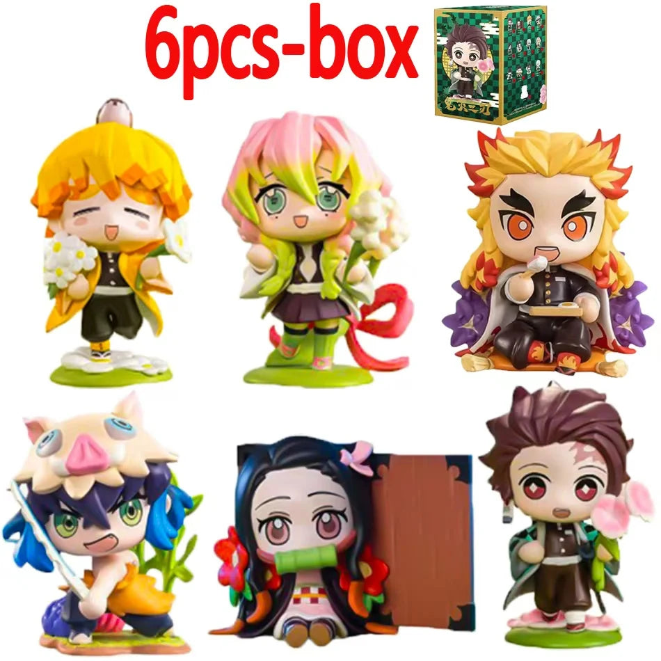 A colorful Demon Slayer Blind Box containing a random cute PVC anime figure of Tanjiro or Nezuko, used as a desktop ornament.