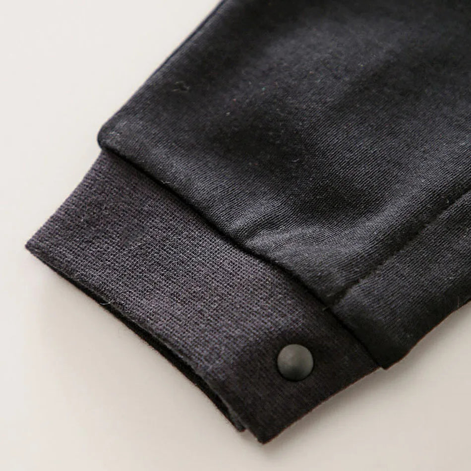 A newborn infant wearing one of the Anime Baby Rompers, a cosplay costume available in Akatsuki, Nezuko, and Tanjirou styles.