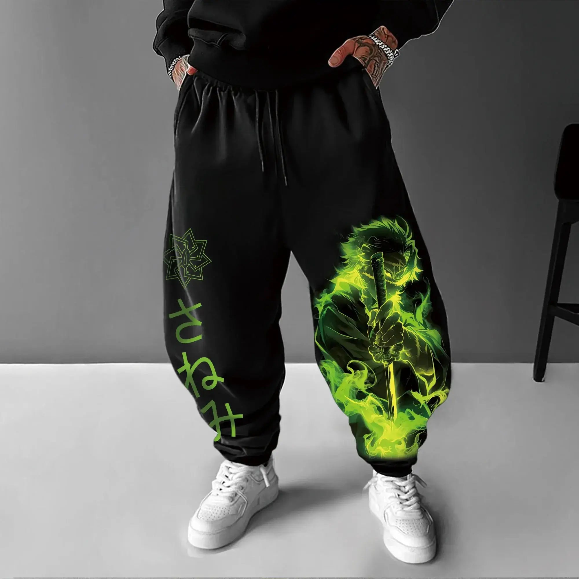 A man wearing the loose-fit Demon Slayer Anime Men Sweatpants with a Japanese cartoon print, showcasing a casual hip hop and Y2K streetwear style.