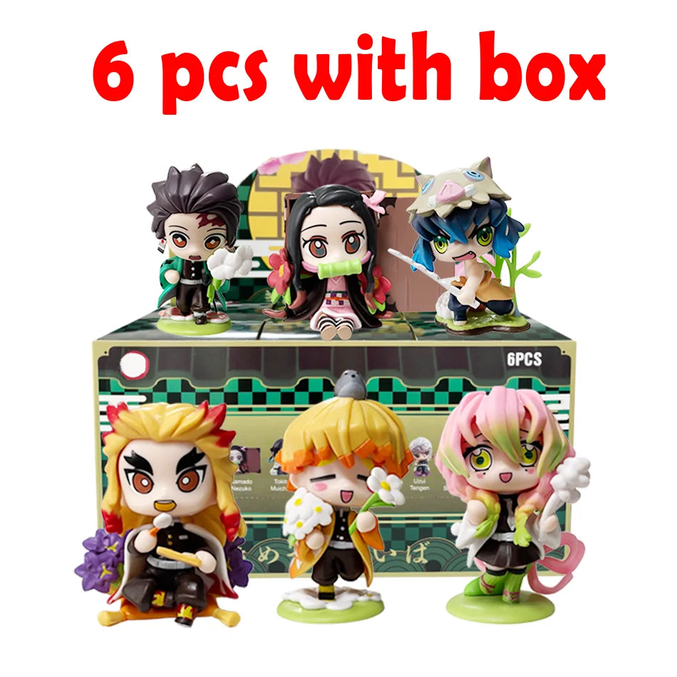 A colorful Demon Slayer Blind Box containing a random cute PVC anime figure of Tanjiro or Nezuko, used as a desktop ornament.