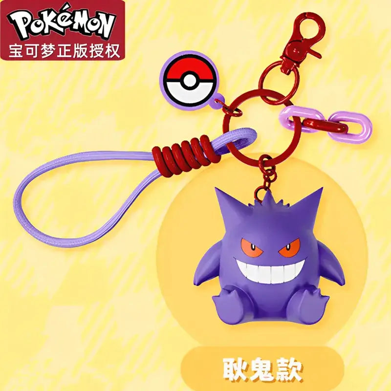 A Genuine Pokemon Keychain featuring a 3D Pikachu and Gengar anime action figure with a fragrance pendant design for backpacks.