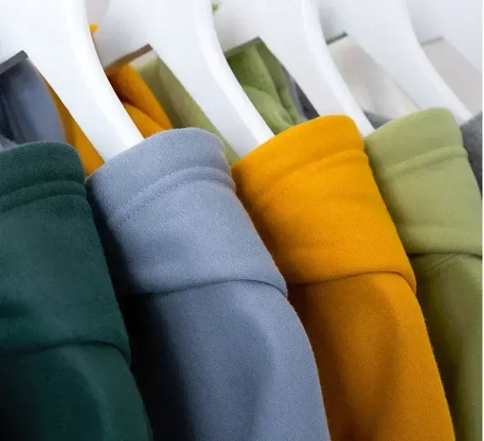 One Piece Luffy Anime Hooded Jacket in various colors hanging on hangers, showcasing casual streetwear style.