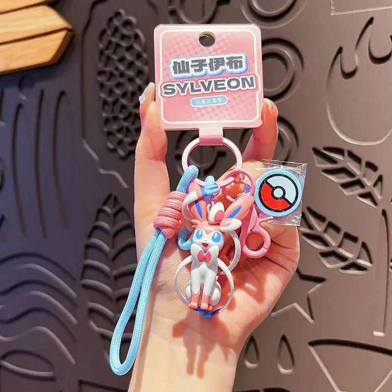 A Genuine Pokemon Keychain featuring a 3D Pikachu and Gengar anime action figure with a fragrance pendant design for backpacks.