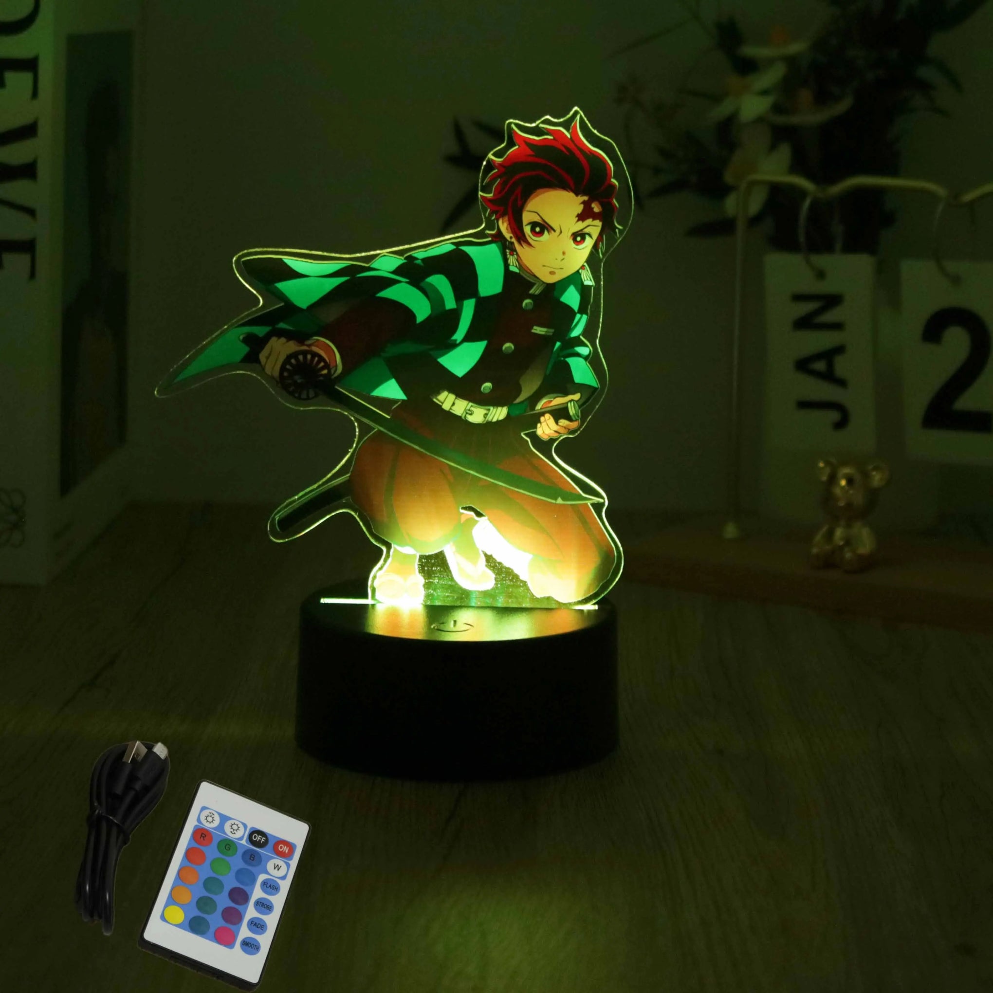 A glowing Demon Slayer 3D Lamp featuring an acrylic Tanjiro and Nezuko figure design, illuminated in blue LED light for bedroom decor.