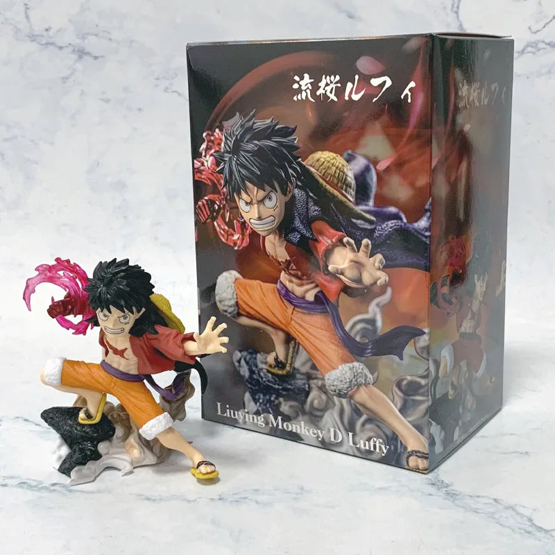 A 10cm One Piece Luffy Figures statue featuring Monkey D. Luffy with a Flowing Cherry Blossom Sakura theme, made of PVC for anime collections.