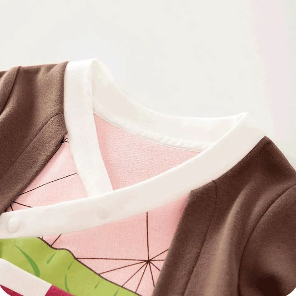 A newborn infant wearing one of the Anime Baby Rompers, a cosplay costume available in Akatsuki, Nezuko, and Tanjirou styles.