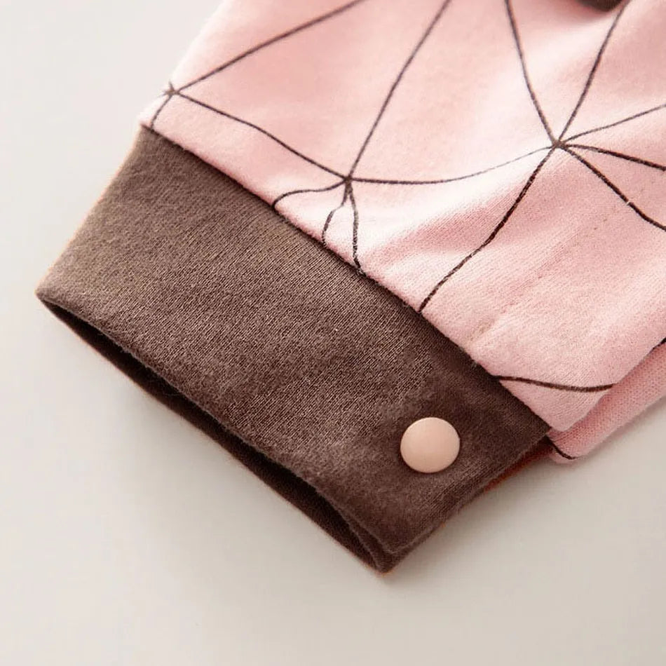 A newborn infant wearing one of the Anime Baby Rompers, a cosplay costume available in Akatsuki, Nezuko, and Tanjirou styles.