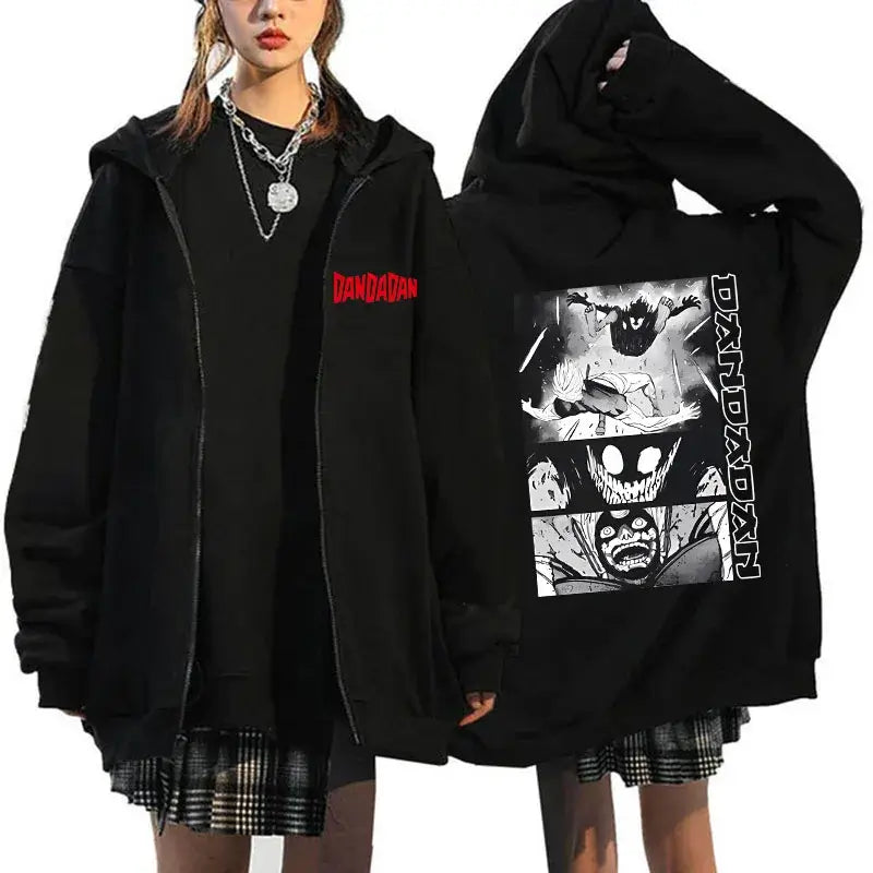 A youthful female model wearing the funny designer Dandadan Okarun Zip Up Hoodie with an anime and manga print.