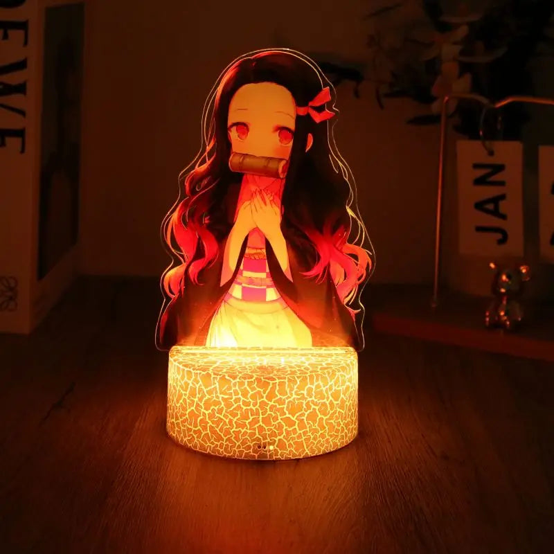 A glowing Demon Slayer 3D Lamp featuring an acrylic Tanjiro and Nezuko figure design, illuminated in blue LED light for bedroom decor.