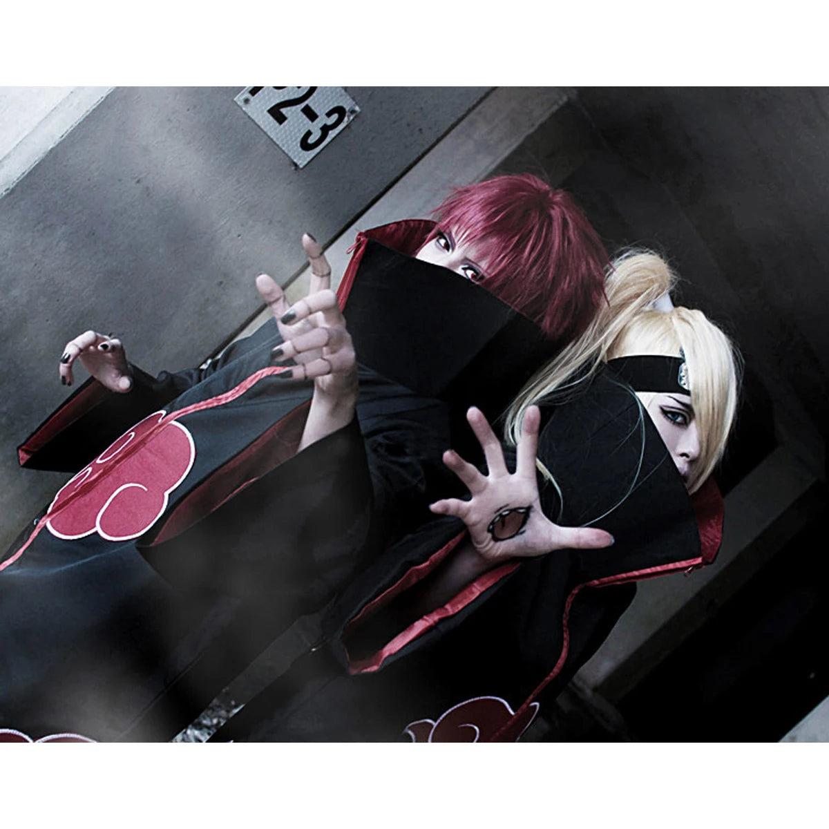 A long black Akatsuki Itachi Cloak cosplay costume featuring iconic red clouds and accessories, suitable for kids and adults for Halloween.