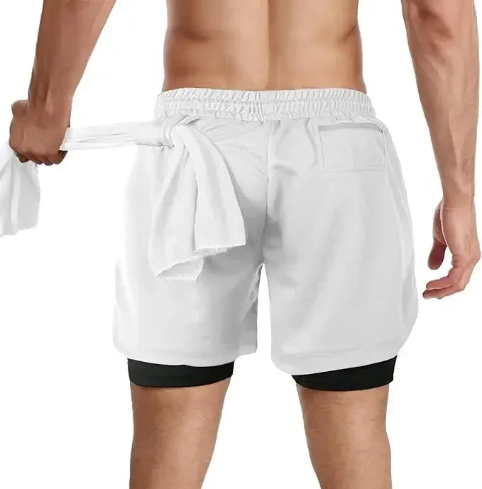 A man wearing the white One Piece Running Shorts for the gym, with a double layer and Straw Hat Crew design.