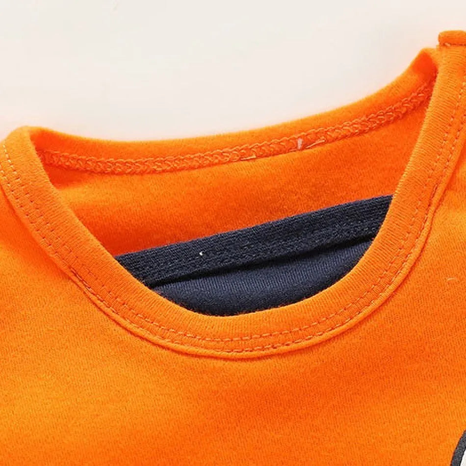 A newborn infant wearing one of the Anime Baby Rompers, a cosplay costume available in Akatsuki, Nezuko, and Tanjirou styles.