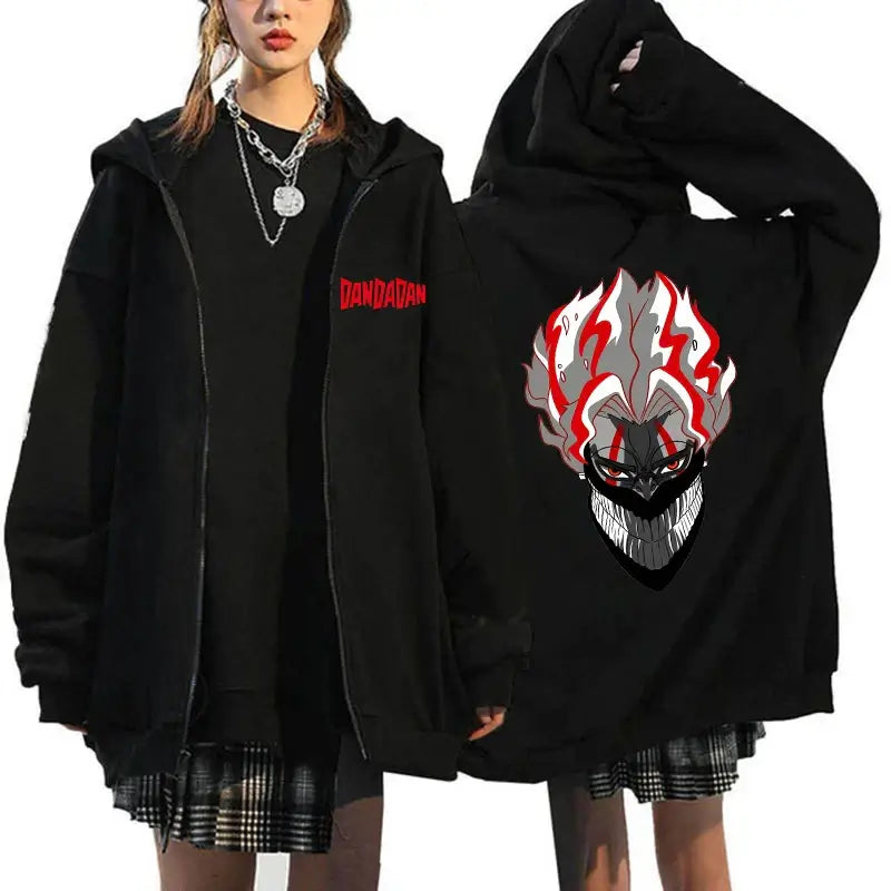 A youthful female model wearing the funny designer Dandadan Okarun Zip Up Hoodie with an anime and manga print.