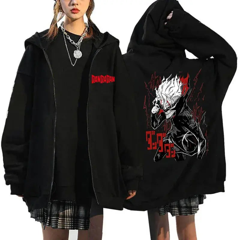 A youthful female model wearing the funny designer Dandadan Okarun Zip Up Hoodie with an anime and manga print.
