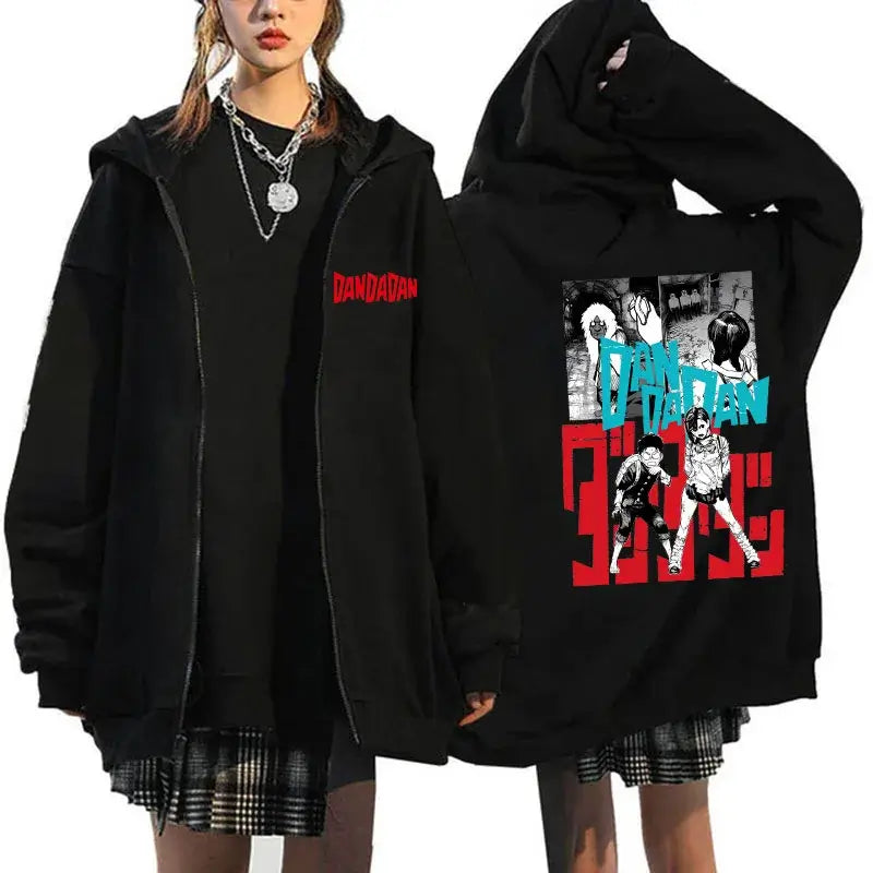 A youthful female model wearing the funny designer Dandadan Okarun Zip Up Hoodie with an anime and manga print.