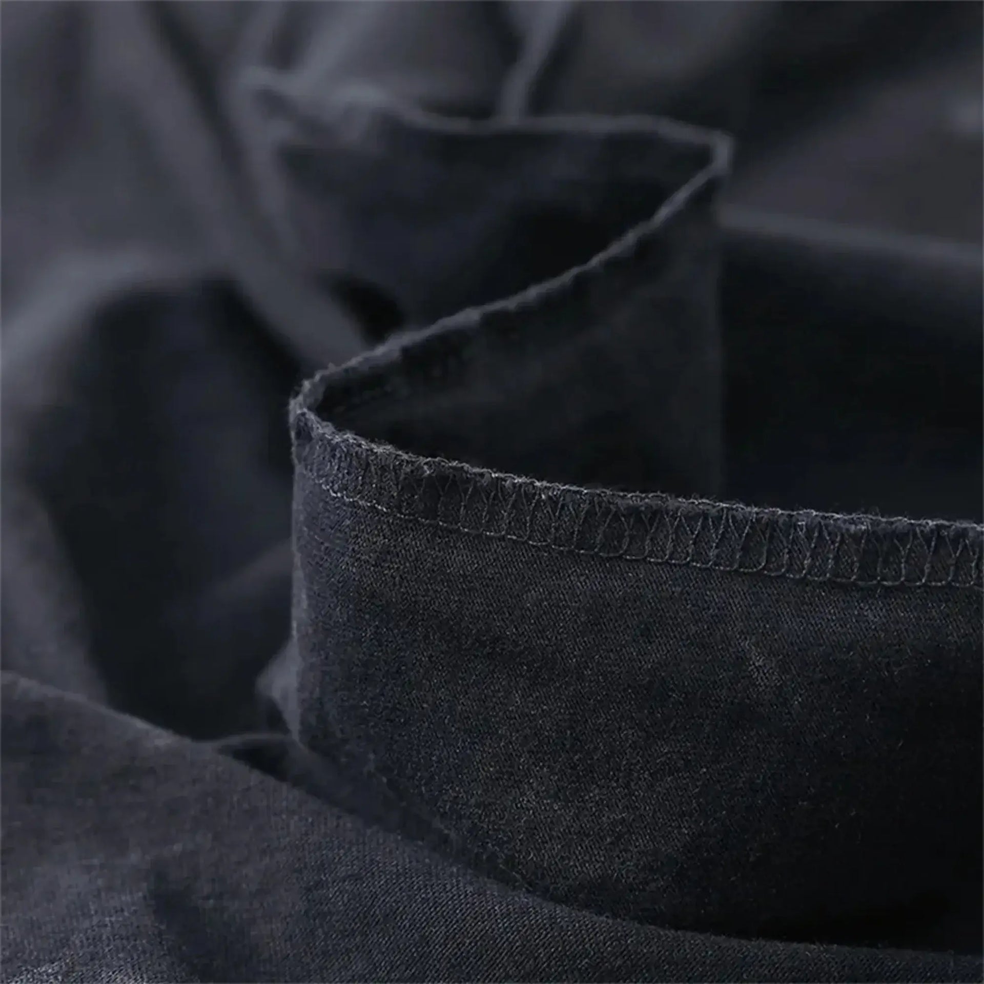 Men's Acid Washed TShirt Streetwear with an oversized fit and a Japanese anime graphic, showcasing a vintage washed black Harajuku style.