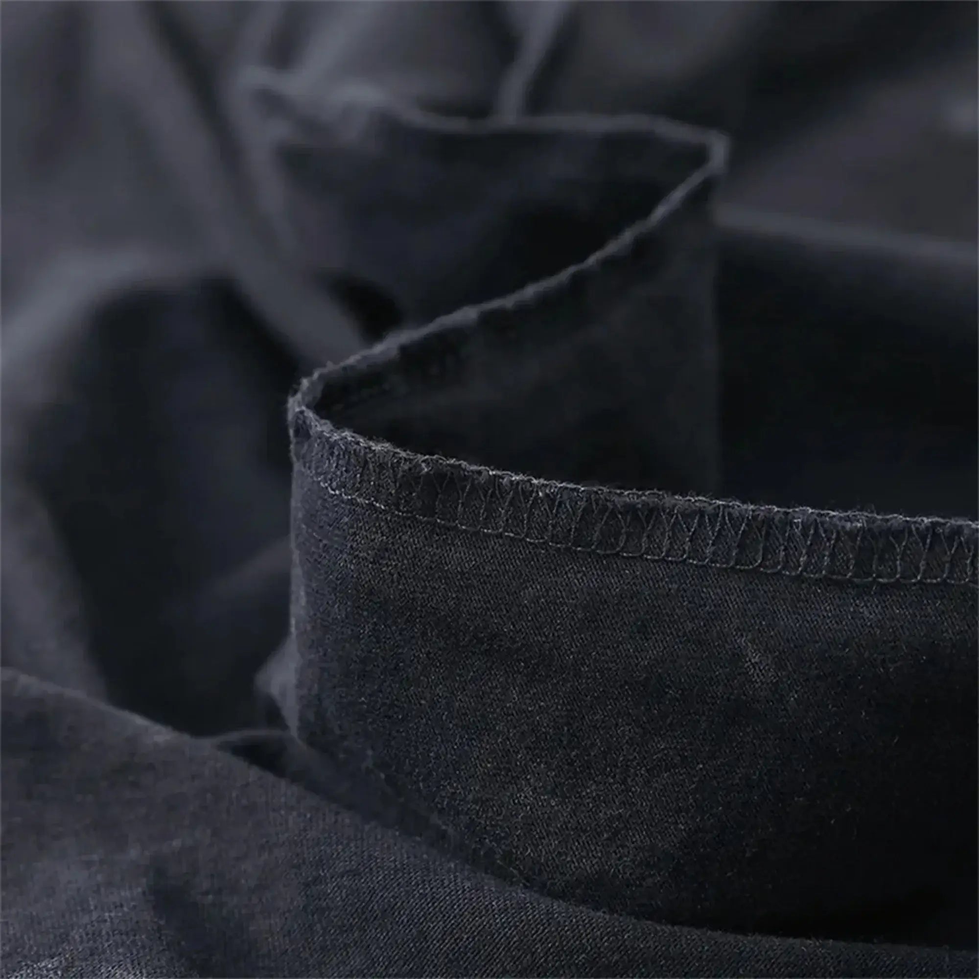 Men's Acid Washed TShirt Streetwear with an oversized fit and a Japanese anime graphic, showcasing a vintage washed black Harajuku style.