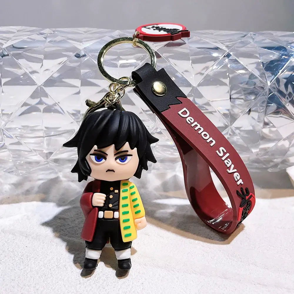 3D Demon Slayer Keychains featuring cute anime character dolls like Tanjiro and Nezuko, used as car ignition accessories and backpack pendants.