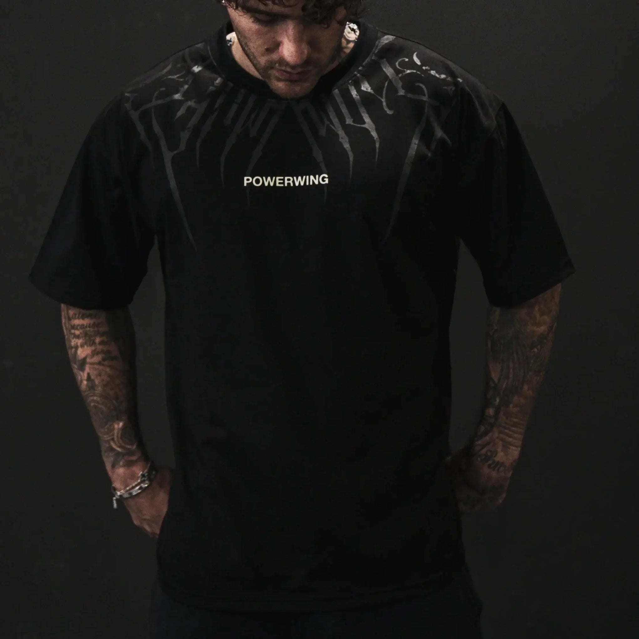 Dark Oversized Cotton Tee Skull Print shown on a model, highlighting the alternative fashion style suitable for men and women's streetwear and gym workouts.