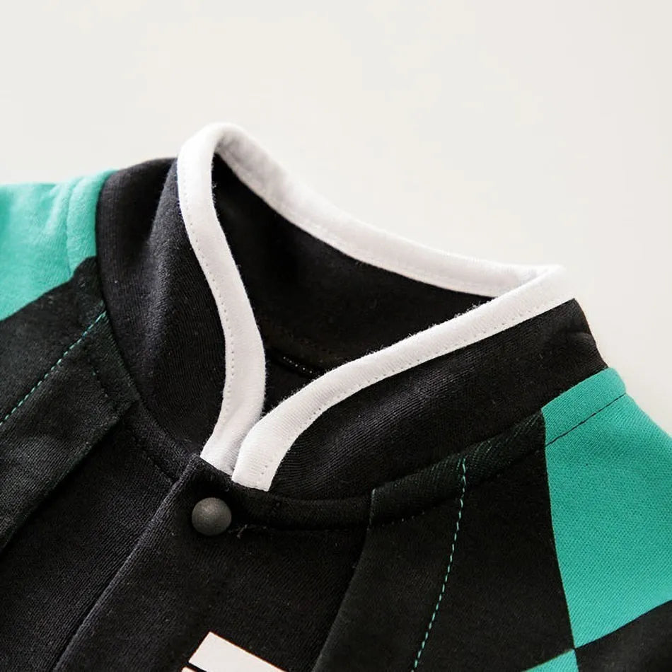 A newborn infant wearing one of the Anime Baby Rompers, a cosplay costume available in Akatsuki, Nezuko, and Tanjirou styles.