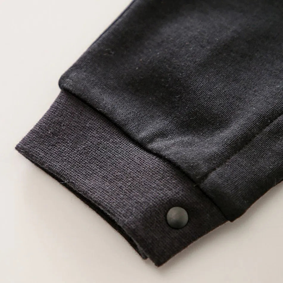 A newborn infant wearing one of the Anime Baby Rompers, a cosplay costume available in Akatsuki, Nezuko, and Tanjirou styles.