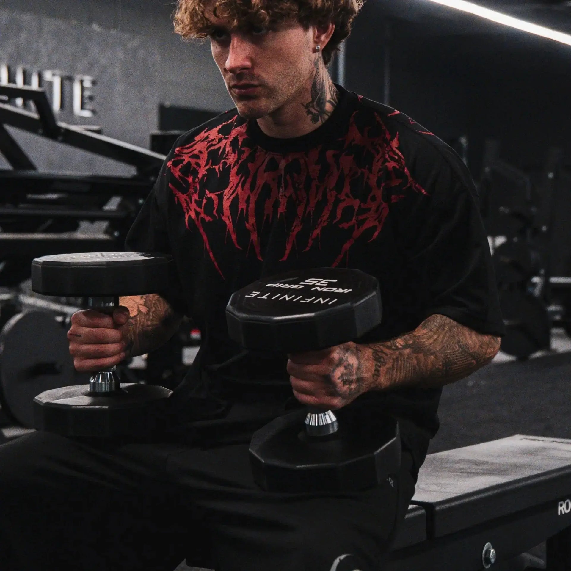 Dark Oversized Cotton Tee Skull Print shown on a model, highlighting the alternative fashion style suitable for men and women's streetwear and gym workouts.
