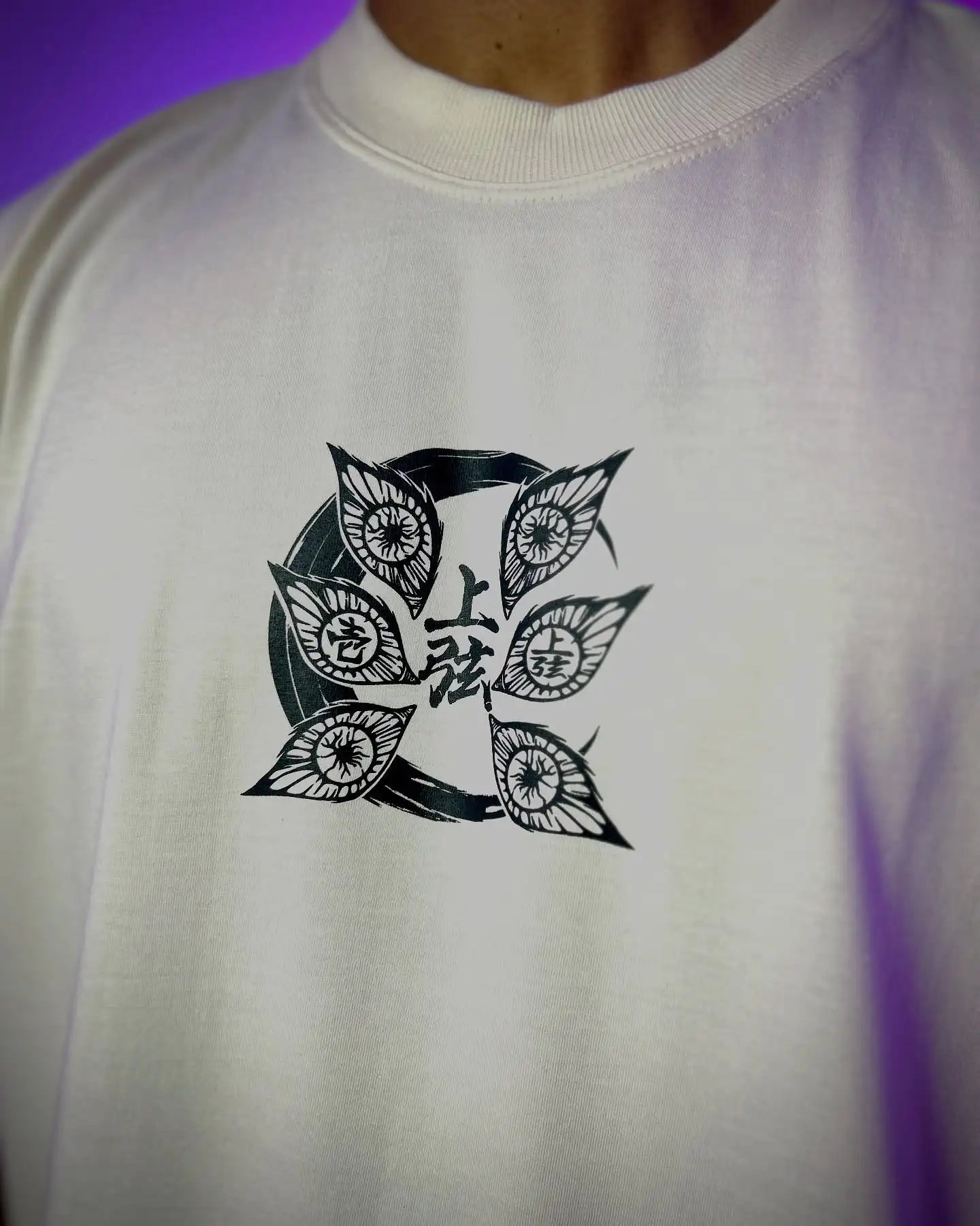 A couple wearing matching oversized Demon Slayer Graphic T Shirts in a hip hop, Y2K streetwear style.