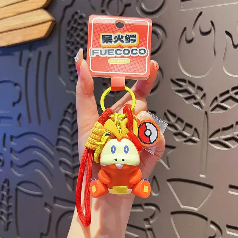 A Genuine Pokemon Keychain featuring a 3D Pikachu and Gengar anime action figure with a fragrance pendant design for backpacks.